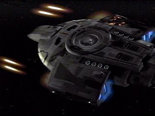 The USS Defiant is severely damaged while fighting the Borg cube during the second Borg incursion into Federation space