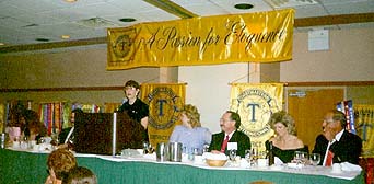 District Governor welcomes dinner guests to Saturday evening Banquet and Humorous Speech Contest
