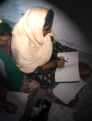 A Student of Adult Functional Literacy Class With Her Grand Daughter