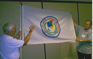 Doc Williams presents the TLC Brotherhood flag to Bill Tilton, President