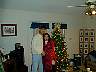 Is that christmas tree tied to her back?!