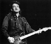 Bono playing guitar