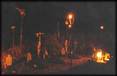 Uncialle's Voodoo Graveyard by torchlight on Halloween night.