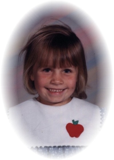 At age 6    Her first school picture
