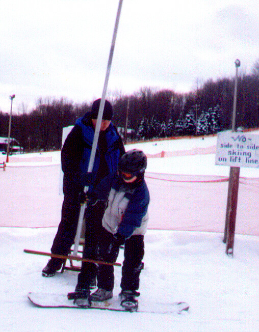 snow boarder on the T-Bar