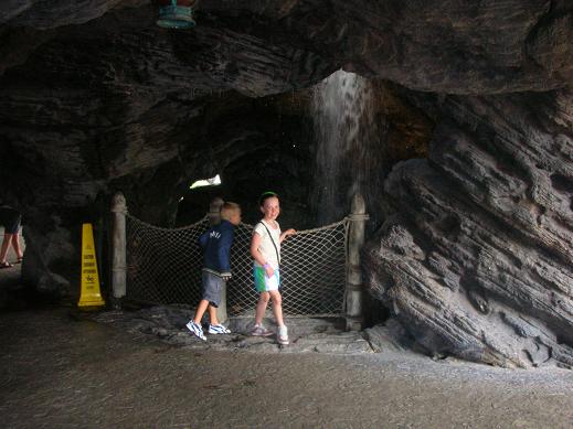 Isabelle standing by a cave in Disneyland Pari