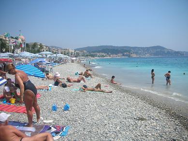 Girl suntanning and using rocks as a bra