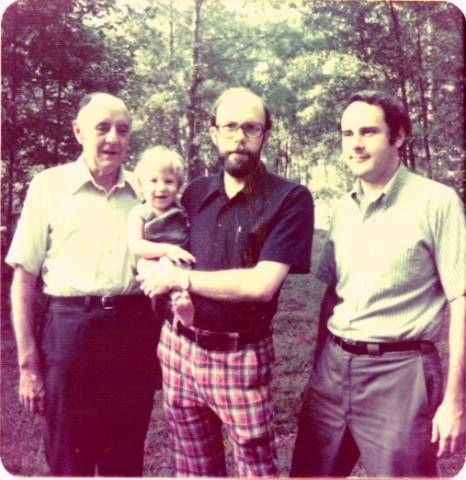 Professor Glenn Chesnut of Indiana University South Bend (center) holding his son Ben around 1975