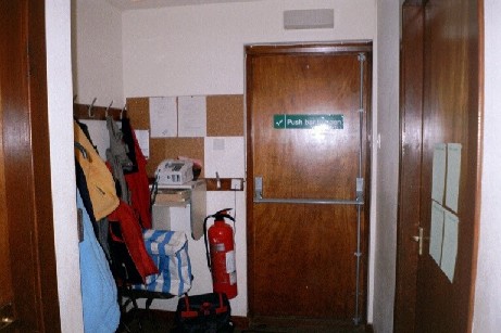 Cloakroom at end of corridor - bedroom door on right, fire exit ahead