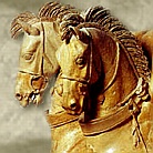 carving of winged chariot horses