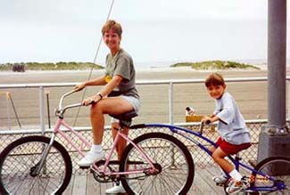 Mom and Chris riding a double bike