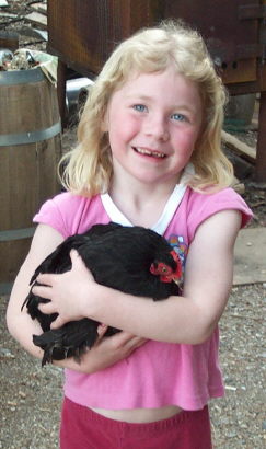 Amy holding the black cochin rooster named Napoleon (the little Emperor)