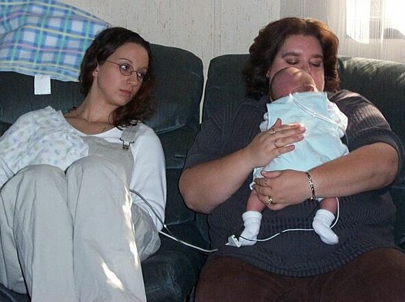 Kathie on left, Kelly on right holding baby