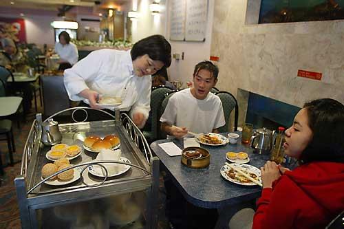 Fong Lam serves dimsum at Seattle's Hong Kong Seafood Restaurant on Rainier Ave South in Rainier Beach