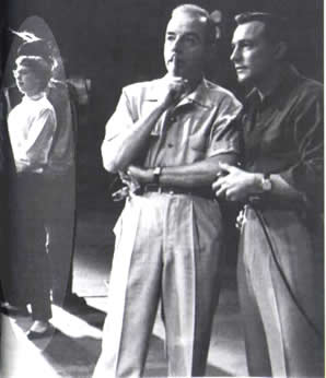 Is that Carol on the left in a pre- Pajama Game cropped hairstyle?... with Minnelli and Kelly in the foreground working or worrying about something.