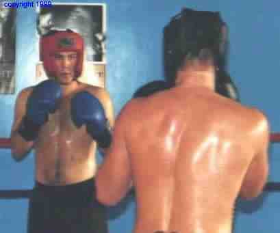 Boxers assume engarde position at start of the round. Photo copyright 1999. All rights reserved.