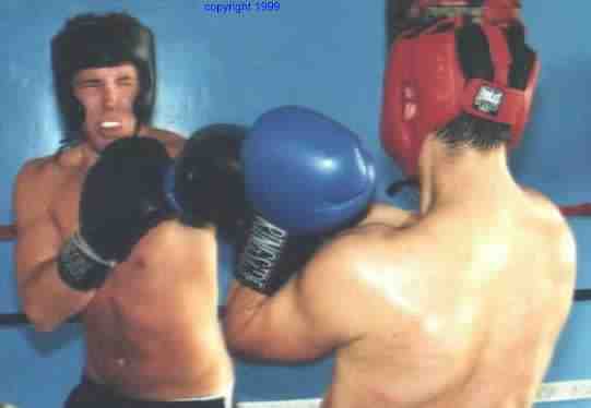 The point of sparring is practice. Keeping good form until it becomes instinct. Photo copyright 1999. All rights reserved.