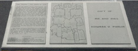 The Placqe In Frount Of Touchdown Jesus