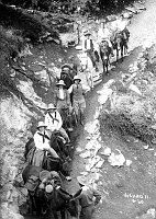MULE PARTY POSING FOR KOLB BROS AT THE START OF A BRIGHT ANGEL TRAIL TRIP. JOHN HANCE IS THIRD FROM THE REAR. JULY 20, 1911.