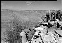 CCC ROCK WALL CONSTRUCTION ALONG RIM BY EL TOVAR HOTEL 5 ENROLLEES WORK WITH ROCKS & CEMENT. 11 SEP 1935 NPS PHOTO