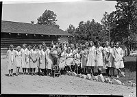 CONCESSIONER PERSONNEL POSED AWAY FROM GRAND CANYON NORTH RIM LODGE WITH PARK SUP'T  TILLOTSON. CHAMBER MAIDS & 1 YOUNG MAN  HOLDING A BANJO. 20 JULY 1930 NPS PHOTO<br>