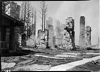 RUINS OF GRAND CANYON LODGE ON NORTH RIM, DESTROYED BY 4 AM KITCHEN FIRE 09/01/32. BLANKETS LAYING OUTSIDE ON GROUND. 04 SEPT 1932.<br>