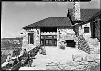 CANYON SIDE PATIO & FIREPLACE OF GRAND CANYON LODGE NORTH RIM JUST AFTER RECONSTRUCTION. CHAIRS IN PLACE. SOME VISITORS. 15 JULY 1937 NPS PHOTO<br><br>