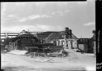 RECONSTRUCTION OF GRAND CANYON LODGE ON THE NORTH RIM BY RYBERG BROTHERS OF SALT LAKE CITY. ROOF TRUSSES GOING UP. 12 OCT 1936 NPS PHOTO<br><br>