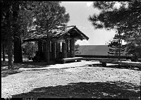 LOG SHELTER AT THE PARKING AREA NEAR THE UTAH PARKS LODGE ON THE NORTH RIM. 10 AUG 1938 NPS PHOTO.