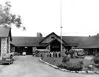 OVERVIEW OF THE &quotSING-AWAY" CEREMONY AS VISITORS LEAVE GRAND CANYON LODGE ON THE NORTH RIM. 2 BUSSES. 23 JUNE 1949<br>