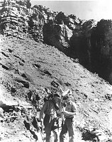 DR DAVID WHITE, PALEONTOLOGIST, AND   PARK NATURALIST, EDWIN MCKEE EXAMINE FOSSILS ON A TRAIL IN THE CANYON. 17 JUNE 1929. NPS, GRANT. 
