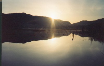 A Beautiful Sunrise At The Lake's Dam