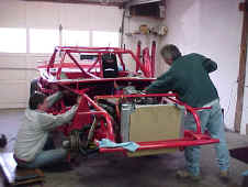 Bruce is working on electrical, and Dave is installing the exhaust pipes.