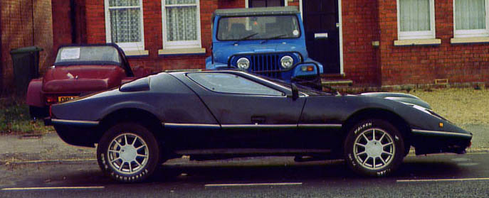 In the foreground the Eagle SS with gullwing doors Wolfrace alloys and a 