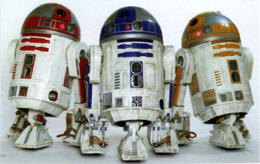 R2-D2 poses with his brothers, R2-D1 and R2-D3.