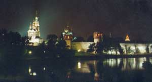 night view from outside, Kremlin wall towers and church domes along Moscwa river