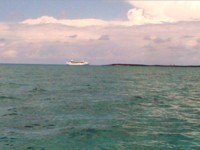 Cruise ship dwarfs the island at Little Stirrup