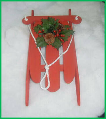 sled13.jpg painted red with holly leaves