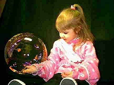 Our Grandchild Brittany holding a dry soap bubble