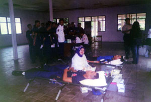 Security guards donating blood for a good cause.