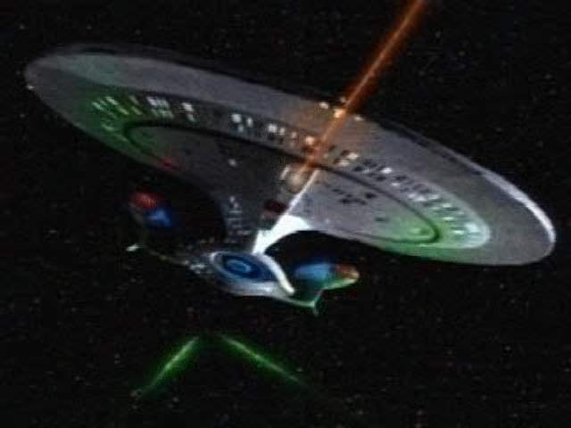 The future Galaxy Class Dreadnought USS Enterprise-D in the Devron System firing its primary hull quantum phaser cannon on a Klingon attack cruiser