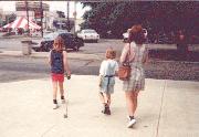 Megan walking a tiny stuffed cat, 1996
