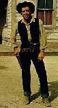 [Photo:Roberts as cowboy]