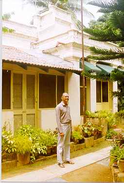 Albert Lobo infront of his mother's house on Berlie St