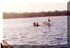 hand-picking shell fish in the middle of the lake