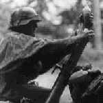 late war Wehrmacht soldier loading 8cm Gr.W.34