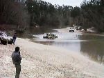 Hummer deep in a creek