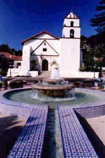 Stand on the fountain with a 28mm lens.