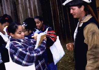 Ashley interviewing a French soldier
