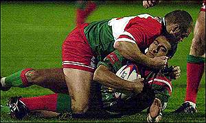 Kieron Cunningham of Wales puts the grip on Hassen Saleh